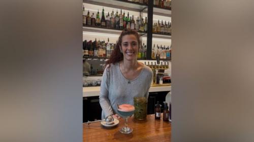 Post Office Place Bartender April Long poses with "What Remains," a Great Salt Lake-inspired cocktail she created for this year's Salt Lake Magazine Farm-to-Glass Cocktail Content (Mariah Maynes/Great Salt Lake Collaborative)