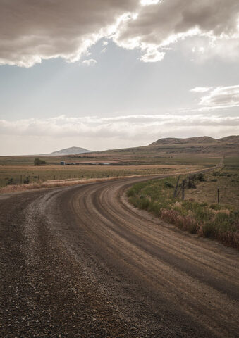 A dirt road cuts through Hansel Valley, in Box Elder County, near the site of the proposed Stratos Project, a massive data center planned for 40,000 acres of land, on Wednesday, May 27, 2026. (Photo by Spenser Heaps for Utah News Dispatch)