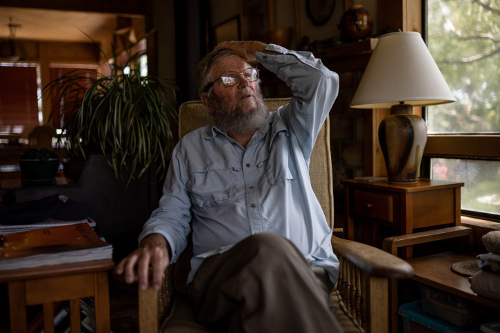 Mike Prather, 75, who has lived near Owens Lake since 1980, sits for a photograph in his home in Alabama Hills, an unincorporated area just outside Lone Pine, California, on Thursday, Aug. 11, 2022.