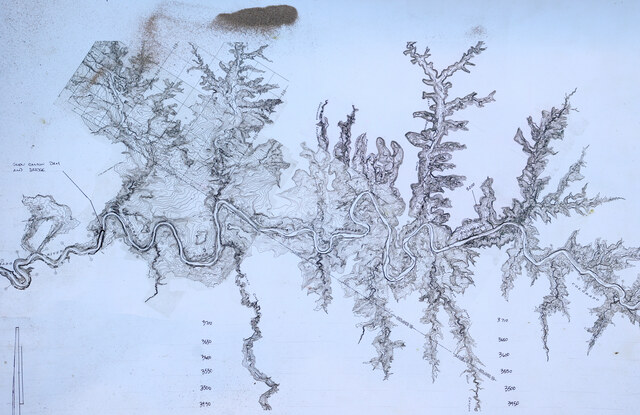 A Returning Rapids Project Colorado River main stem scroll map, made from 1923 USGS topographical data, is rolled out in the sand on a Returning Rapids trip in Cataract Canyon on Friday, Sept. 20, 2024.