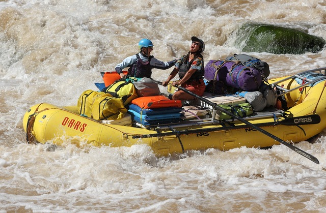 Meg Flynn, Returning Rapids researcher, and Cheyenne Klemme, Returning Rapids guide, react to successfully navigating Big Drop 3 in Cataract Canyon on the Colorado River on Thursday, Sept. 19, 2024.