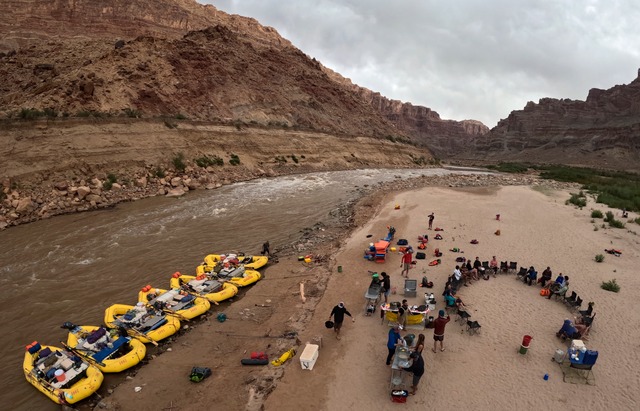 A group of river experts, scientists, water rights lawyers, tribal representatives, nonprofit representatives, philanthropists and river guides camp with Returning Rapids Project next to Gypsum Canyon rapid in Cataract Canyon on Saturday, Sept. 21, 2024. The Gypsum Canyon rapid only recently reemerged after being under the flat water of Lake Powell for decades.