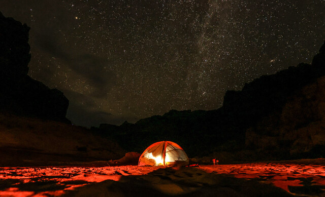 Stars dot the sky above Rockfall Canyon campsite in Cataract Canyon during a six day Colorado River trip with the Returning Rapids Project on Saturday, Sept. 21, 2024.