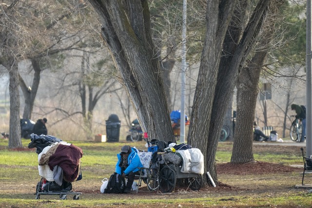 (Rick Egan | The Salt Lake Tribune) People gather on the lawn near the Jordan River, on Tuesday, Jan 13, 2026.