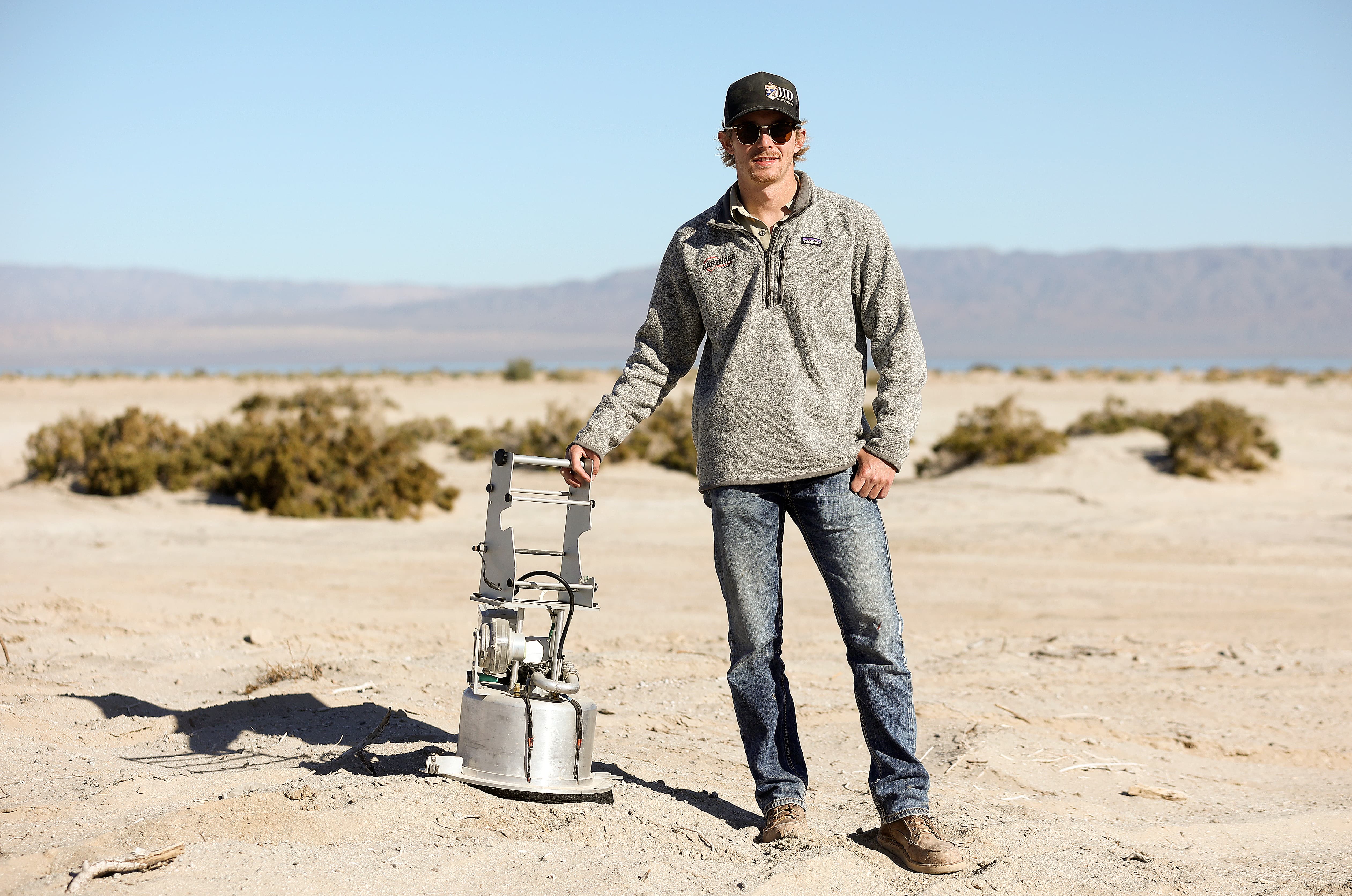 Ross Wilson, Imperial Irrigation District environmental specialist, poses for a portrait with a PI-SWERL, which stands for Portable In-Situ Wind ERosion Lab, in Salton City, Calif., on Wednesday, Dec. 13, 2023.