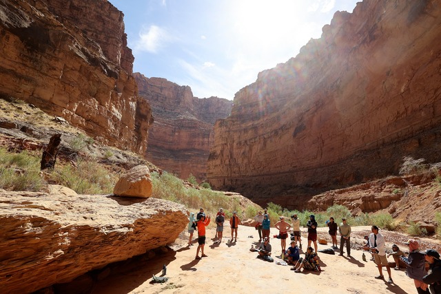 Eric Balken, Glen Canyon Institute executive director, gives a talk in Clearwater Canyon during a Returning Rapids trip through Cataract Canyon on the Colorado River on Saturday, Sept. 21, 2024. Where the group is standing would have been under 20-30 feet of water when Lake Powell was at its highest, estimates Mike DeHoff, Returning Rapids principal investigator.