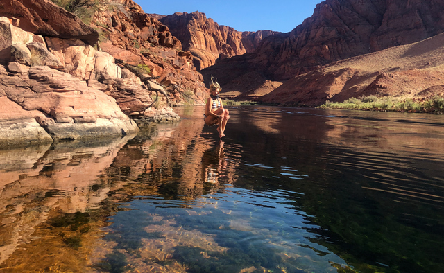 Morgan VerMerris jumps into the clear water of the Colorado River below Glen Canyon Dam, near Lee’s Ferry, on Sept. 13, 2019. As sediment builds up in rivers and reservoir above the dam, the clear downstream river is lacking in the nutrient-dense sediment that can’t get past the dam.