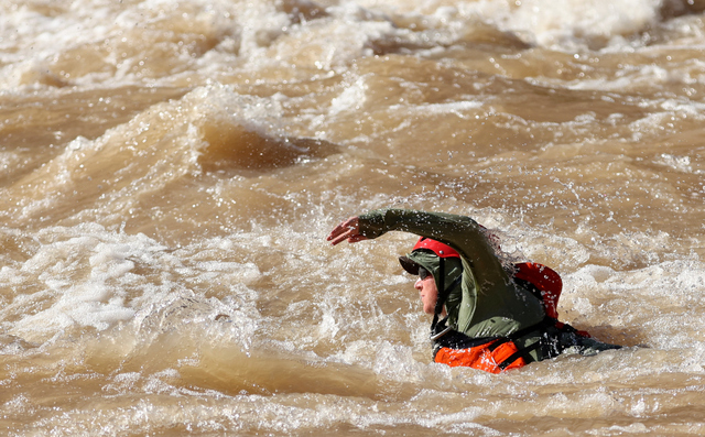 John Berggren, Western Resource Advocates regional policy manager, swims in Gypsum Canyon rapid on a Returning Rapids trip in Cataract Canyon on the Colorado River on Friday, Sept. 20, 2024. The Gypsum Canyon rapid only recently reemerged after being under the flat water of Lake Powell for decades.