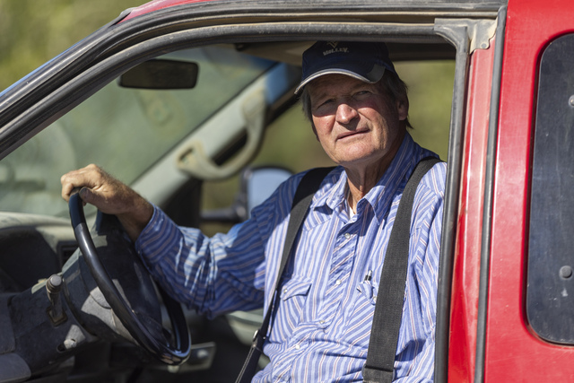 Chris Dunham looks into the distance while siting and talking in his pickup truck on the Dunham farm in Green River on Thursday, Sept. 19, 2024. Dunham is a third generation melon grower carrying on the tradition of farming melons in Green River.