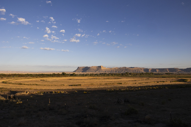 The early morning light shines onto farm land irrigated with water from the Green River in Green River on Friday, Sept. 20, 2024.