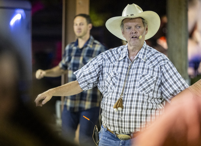 Hoedown caller Paul Welcker teaches people western dances during the 118th annual Melon Days Festival in Green River on Friday, Sept. 20, 2024.