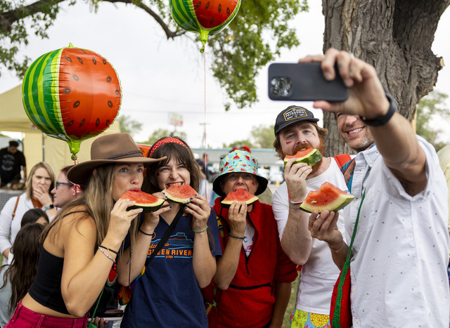 From right to left, Matt Beatty, Noah Myers, Vanessa Adams, Bella Beatty and Amy Beatty take a selfie eating watermelon during the 118th annual Melon Days Festival in Green River on Saturday, Sept. 21, 2024. The Beattys have been coming to Green River’s Melon Days Festival with family and friends for over a decade.