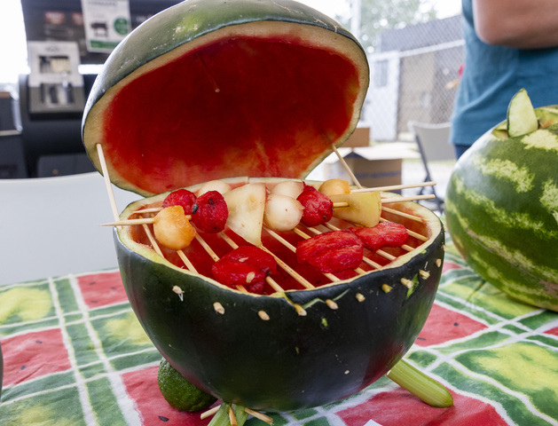 A watermelon carved to look like a grill is presented during the 118th annual Melon Days Festival in Green River on Saturday, Sept. 21, 2024.