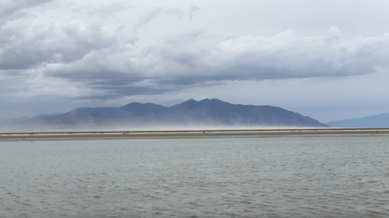 A dust storm blows off the exposed lake bed of the Great Salt Lake at Farmington Bay and into Salt Lake City on August 19, 2022. (Ben Winslow/Fox 13)