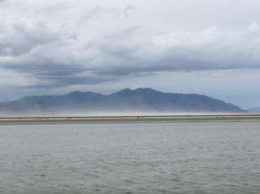 A dust storm blows off the exposed lake bed of the Great Salt Lake at Farmington Bay and into Salt Lake City on August 19, 2022. (Ben Winslow/Fox 13)