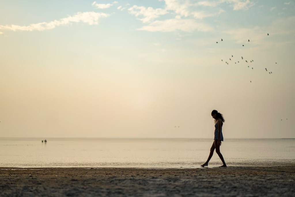 (Rick Egan | The Salt Lake Tribune) Dibora Sahile wades in the Great Salt Lake, on Thursday, Aug. 8, 2024.