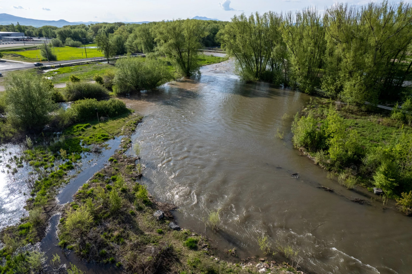 The Logan River runs high through Rendezvous Park on Thursday, May 18, 2023. (Trent Nelson | The Salt Lake Tribune)