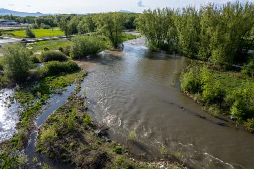 The Logan River runs high through Rendezvous Park on Thursday, May 18, 2023. (Trent Nelson | The Salt Lake Tribune)
