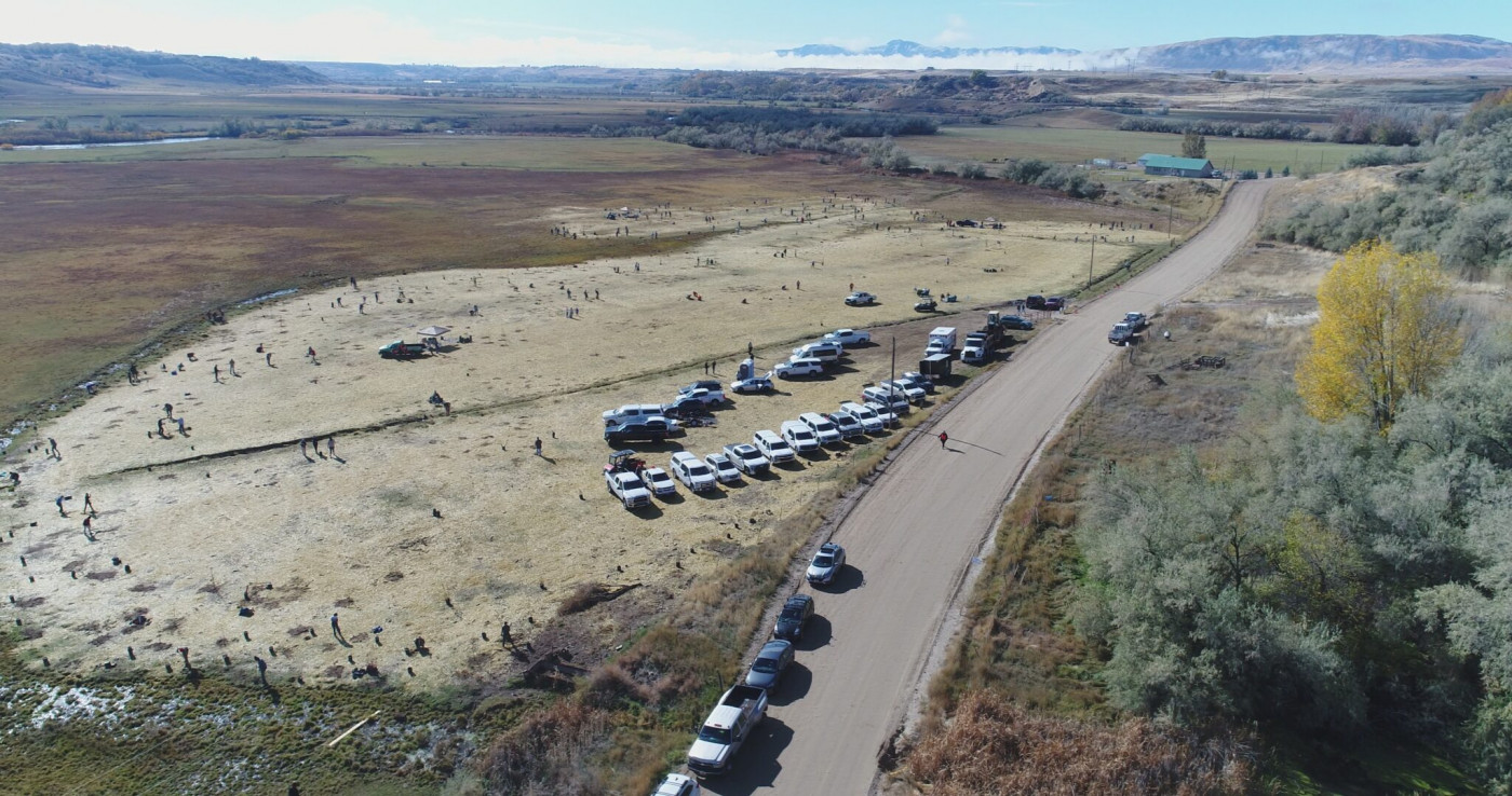 Volunteers help plant new vegetation as part of the Northwestern Band of the Shoshone Nation’s restoration project along the Bear River near Preston, Idaho, where an 1863 massacre almost entirely annihilated their people. (Photo Courtesy of the Northwestern Band of the Shoshone Nation)