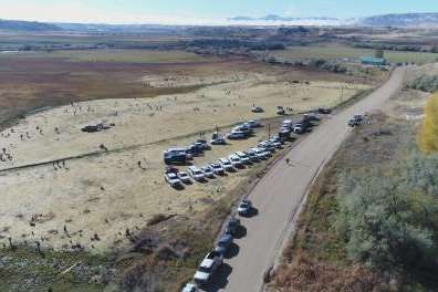 Volunteers help plant new vegetation as part of the Northwestern Band of the Shoshone Nation’s restoration project along the Bear River near Preston, Idaho, where an 1863 massacre almost entirely annihilated their people. (Photo Courtesy of the Northwestern Band of the Shoshone Nation)