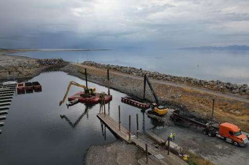 (Francisco Kjolseth | The Salt Lake Tribune) Crews work to dredge the Great Salt Lake Marina as water levels continue to drop at the saline lake on Tuesday, Aug. 26, 2025.