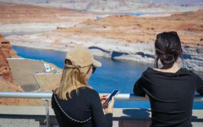(David Condos, KUER) Visitors look over Lake Powell from a viewpoint at the Glen Canyon Dam, Oct. 5, 2025. Years of drought and overuse across the Colorado River Basin have shrunk water levels at Lake Powell, the nation’s second-largest reservoir. (David Condos, KUER) Visitors look over Lake Powell from a viewpoint at the Glen Canyon Dam, Oct. 5, 2025. Years of drought and overuse across the Colorado River Basin have shrunk water levels at Lake Powell, the nation’s second-largest reservoir.