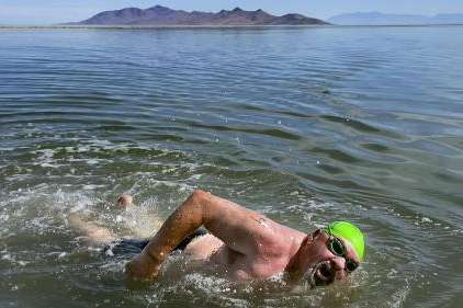 Lane Henderson, of Riverton, competes in a 1-mile open swim competition at Great Salt Lake State Park in Magna on Saturday, June 11, 2022.Laura Seitz, Deseret News
