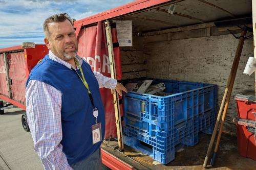(Eric S. Peterson, The Utah Investigative Journalism Project) Environmental Program Manager Kevin Staples points out one of the 37 spills kits located at the airport.