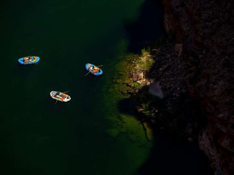 (Trent Nelson | The Salt Lake Tribune) Rafts on the Colorado River as seen from Navajo Bridge in Ariz. on Tuesday, May 20, 2025.