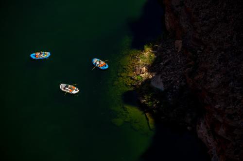 (Trent Nelson | The Salt Lake Tribune) Rafts on the Colorado River as seen from Navajo Bridge in Ariz. on Tuesday, May 20, 2025.