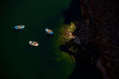 (Trent Nelson | The Salt Lake Tribune) Rafts on the Colorado River as seen from Navajo Bridge in Ariz. on Tuesday, May 20, 2025.