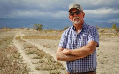 (David Condos | KUER) Carbon County farmer Kevin Cotner stands next to a bare field south of Price, Sept. 30, 2025. He&rsquo;s one of around a dozen Utah farmers who are leaving some of their land unplanted and unirrigated this year as part of a state effort to leave more water for the Colorado River.