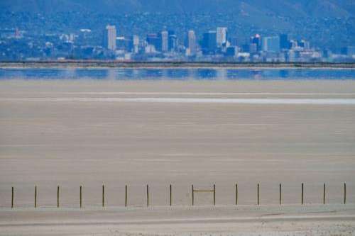 (Trent Nelson | The Salt Lake Tribune) The shore of the Great Salt Lake, with Salt Lake City in the distance, as seen from Antelope Island on Thursday, May 1, 2025.