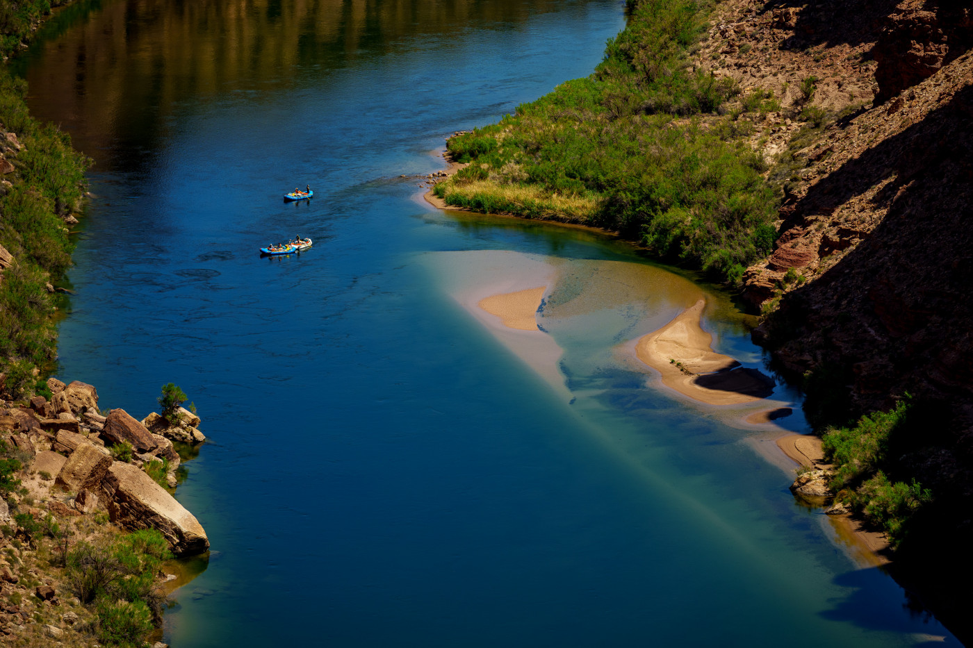 (Trent Nelson  |  The Salt Lake Tribune) Rafts on the Colorado River as seen from Navajo Bridge in Ariz. on Tuesday, May 20, 2025.