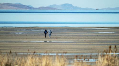 Two people walk toward the water on the sandbar at the Great Salt Lake near Magna on Jan. 6. University of Utah researchers used electromagnetic data to locate a deep freshwater reservoir beneath Farmington Bay. Two people walk toward the water on the sandbar at the Great Salt Lake near Magna on Jan. 6. University of Utah researchers used electromagnetic data to locate a deep freshwater reservoir beneath Farmington Bay. (Scott G Winterton, Deseret News)