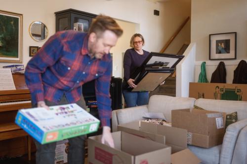  Jared and Adrienne Cardon pack moving boxes at their home in Orem on Saturday, Feb. 28, 2026. (Photo by Spenser Heaps for Utah News Dispatch)