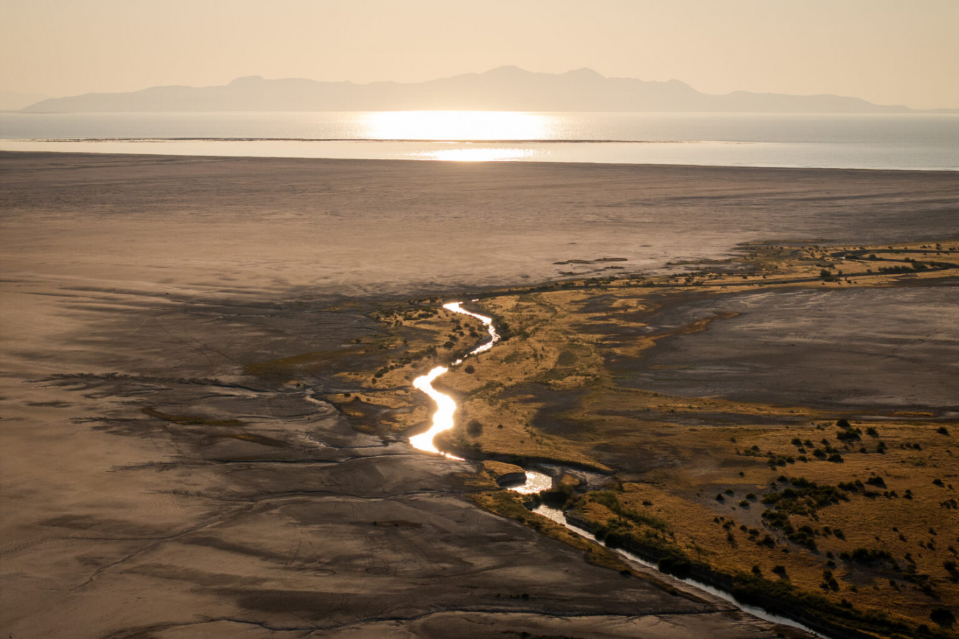 Lee Creek flows through mudflats into the Great Salt Lake near Magna on Tuesday, Aug. 5, 2025. (Photo by Spenser Heaps for Utah News Dispatch)