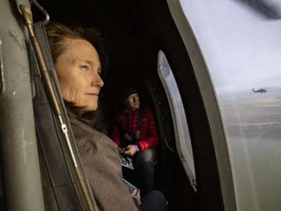 Sen. Kathleen Riebe, D-Cottonwood Heights, and Rep. Jeffrey Stenquist, R-Draper, look out the windows as they and other Utah lawmakers take an aerial tour of the Great Salt Lake by Blackhawk helicopters from the Air National Guard. The group left from the Capitol in Salt Lake City Utah on Tuesday, Feb. 15, 2022.