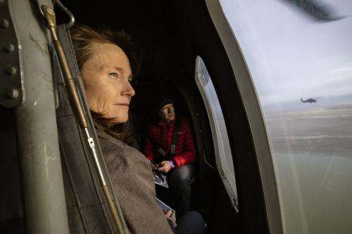 Sen. Kathleen Riebe, D-Cottonwood Heights, and Rep. Jeffrey Stenquist, R-Draper, look out the windows as they and other Utah lawmakers take an aerial tour of the Great Salt Lake by Blackhawk helicopters from the Air National Guard. The group left from the Capitol in Salt Lake City Utah on Tuesday, Feb. 15, 2022.