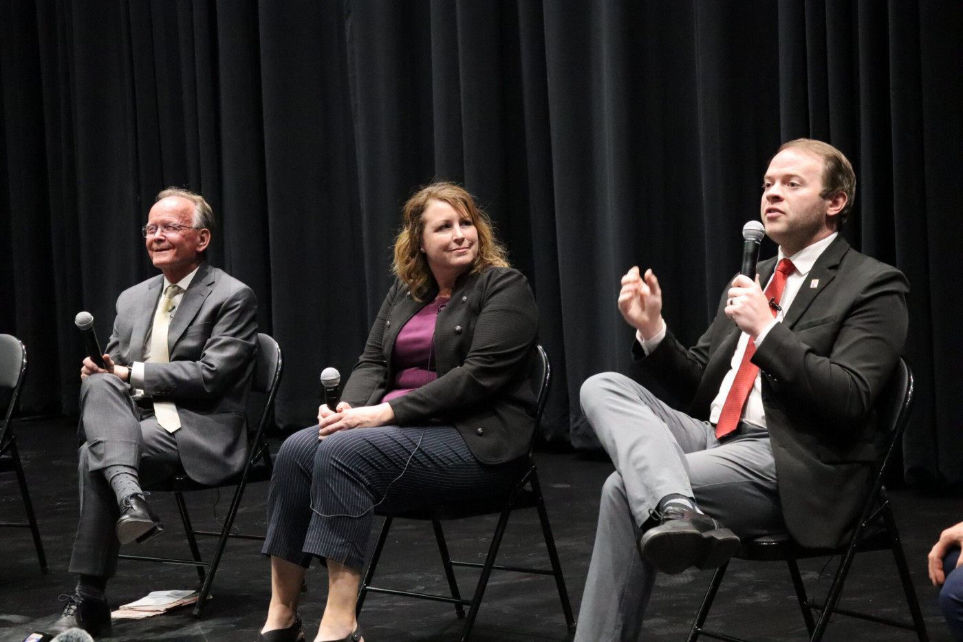 From left, candidates Senate President Stuart Adams, Stephanie Hollist and Braden Hess participate in a candidate forum at Sunset Junior High in Sunset, Utah on June 16, 2026. (Katie McKellar/Utah News Dispatch)