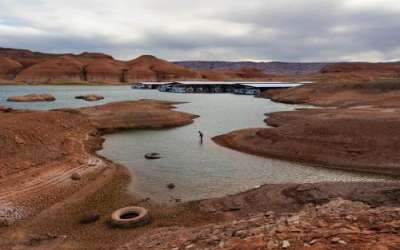 (Francisco Kjolseth | The Salt Lake Tribune) A fisherman tries his luck in the receding waters near Bullfrog Marina at Lake Powell on Friday, Saturday, April 24, 2026. Glen Canyon National Recreation Area officials plan to move the marina to the deeper waters in the main channel of the reservoir across from Halls Crossing. (Francisco Kjolseth | The Salt Lake Tribune) A fisherman tries his luck in the receding waters near Bullfrog Marina at Lake Powell on Friday, Saturday, April 24, 2026. Glen Canyon National Recreation Area officials plan to move the marina to the deeper waters in the main channel of the reservoir across from Halls Crossing.