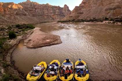 Boaters lounge on rafts near a mudbank at Lower Ten Cent campsite in Cataract Canyon on the Colorado River on Sept. 19, 2024. Utah added four new members to its Colorado River Authority of Utah board on Tuesday. (Kristin Murphy, Deseret News)