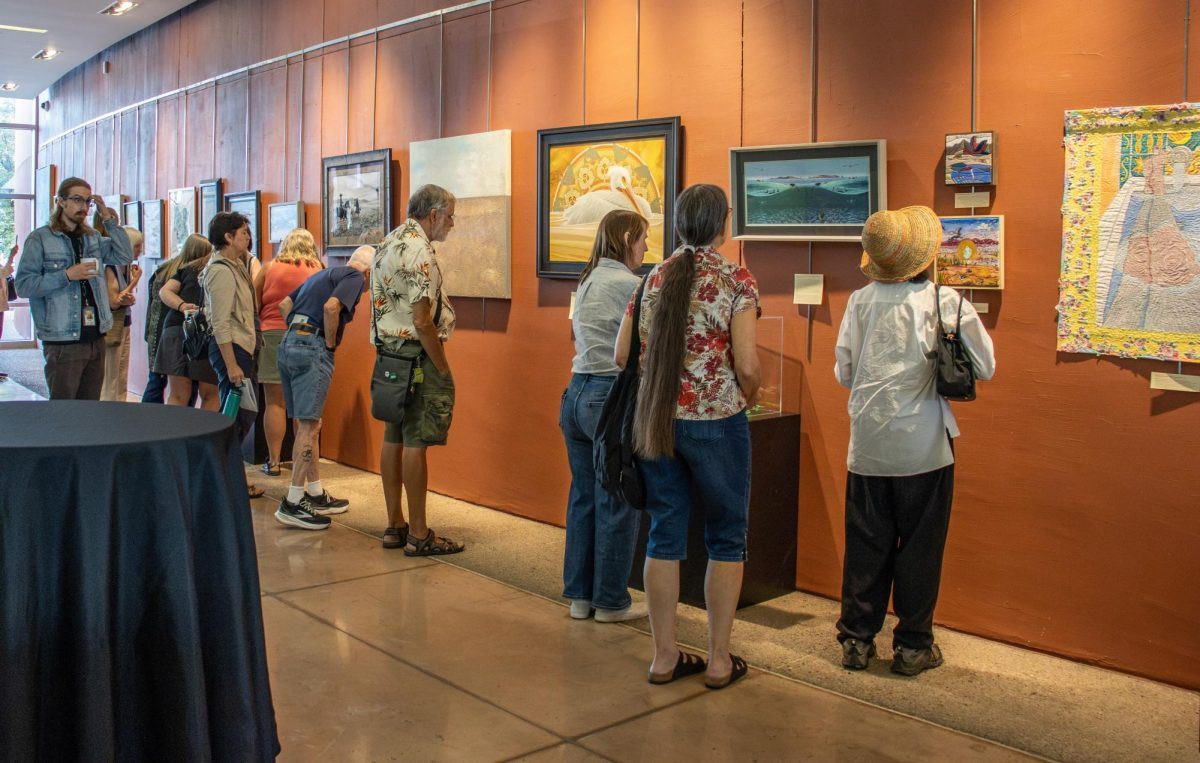Visitors explore the Great Salt Lake art exhibit at the Sorenson Unity Center for the 13th annual Alfred Lambourne Arts Program, on Aug. 28, 2026. (Photo by Zane Poss | The Daily Utah Chronicle)