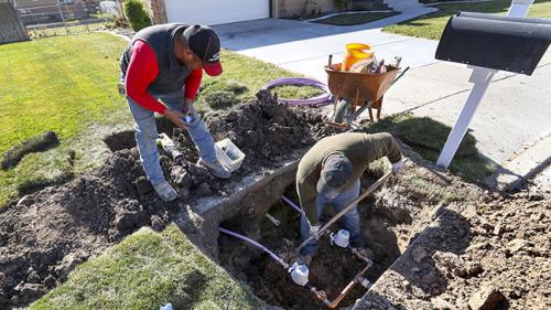 Ormond Construction crews install secondary water meters in a subdivision in Woods Cross for the Weber Basin Water Conservancy District on Thursday, Nov. 7, 2019. Only 15% of secondary water connections in Utah are metered, which means that a small group of users can tell how much of the finite resource they are using and also find out how they compare to their neighbors. (Steve Griffin/Deseret News)