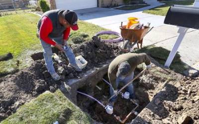 Ormond Construction crews install secondary water meters in a subdivision in Woods Cross for the Weber Basin Water Conservancy District on Thursday, Nov. 7, 2019. Only 15% of secondary water connections in Utah are metered, which means that a small group of users can tell how much of the finite resource they are using and also find out how they compare to their neighbors. (Steve Griffin/Deseret News)