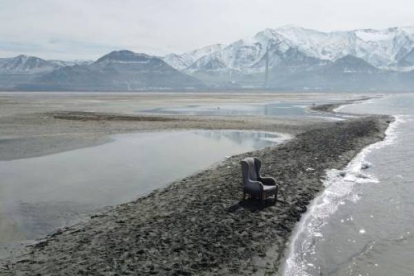 Rick Bowmer / AP A chair sits on an exposed sand bar on the southern shore of the Great Salt Lake on March 3, 2022, near Salt Lake City. The Great Salt Lake has hit a new historic low for the second time in less than a year. Utah Department of Natural Resources said Monday, June 5, 2022, in a news release, the lake dipped Sunday to 4,190.1 feet.