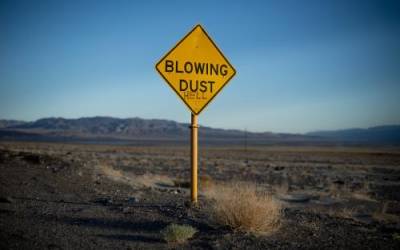A sign warning of blowing dust has been vandalized near the small community of Keeler, which sits on the northwest side of the dry lakebed of Owens Lake in Inyo County, California, on Thursday, Aug. 11, 2022. Spenser Heaps, Deseret News
