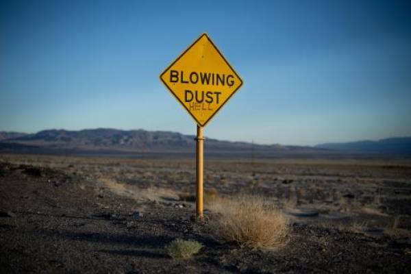 A sign warning of blowing dust has been vandalized near the small community of Keeler, which sits on the northwest side of the dry lakebed of Owens Lake in Inyo County, California, on Thursday, Aug. 11, 2022. Spenser Heaps, Deseret News