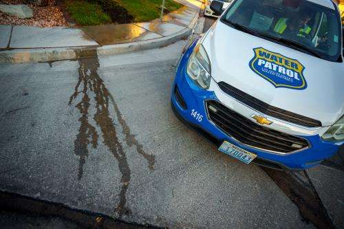 (Trent Nelson | The Salt Lake Tribune) Salvador Polanco-Gamez, a conservation aide with the Las Vegas Valley Water District, patrols in Summerlin, a community in the Las Vegas Valley, Nevada on Thursday, Sept. 29, 2022. When runoff water from a home's sprinklers reaches the street, Polanco-Gamez stops to document the situation and notify the homeowner.