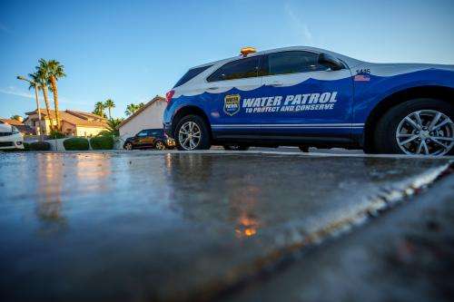 (Trent Nelson | The Salt Lake Tribune) Salvador Polanco-Gamez, a conservation aide with the Las Vegas Valley Water District, patrols in Summerlin, a community in the Las Vegas Valley, Nevada on Thursday, Sept. 29, 2022. When runoff water from a home's sprinklers reaches the street, Polanco-Gamez stops to document the situation and notify the homeowner.